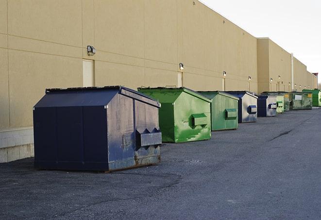 a row of construction dumpsters parked on a jobsite in Foothill Ranch